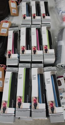 boxes of cell phones are stacked on top of each other on a table