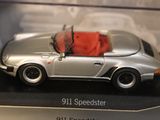 a model of a porsche 911 speedster in a display case
