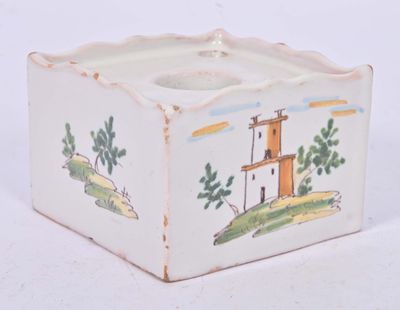 a small white box with a picture of a lighthouse on it