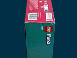a box of toothpaste sitting on a blue surface