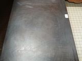 a black table with a metal top in a kitchen