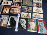 many pictures of cats that are on the table