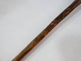 a baseball bat with a wooden handle on a table
