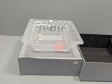 a box of pills and a tray of pills on a table