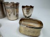 a silver container and a silver spoon on a table