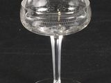 a clear glass that is sitting on a black table