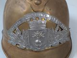 a gold helmet with a crown on top of it