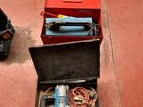 two tools in a case on the ground