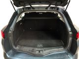 the back of a car with its trunk open and the back of the car in the back