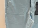a picture of a pair of light blue pants hanging on a wall