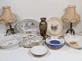 many different types of plates and bowls on the table