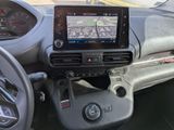 the dashboard of a car with a gps device in it