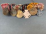 a small group of medals and medals on a table