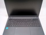 a laptop with a keyboard on it sitting on a table