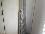 a ladder in the corner of a room that is being remodeled