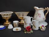 many different types of vases and bowls on the table