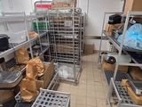 a room filled with lots of metal shelves and bins