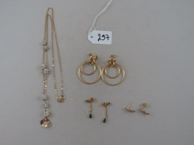 some gold and silver jewelry including a necklace, earrings, and a ring