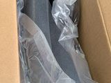 a bottle of water in a box with plastic wrap around it