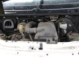 a car engine with the hood up and the hood down