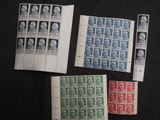 four different types of stamps on a black surface