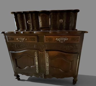 a wooden cabinet that has a pot on top of it