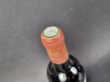 a bottle of wine that is sitting on a table