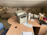 a printer sitting on top of a desk in a living room