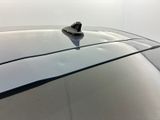 a close up of a car ' s roof with a small object on it