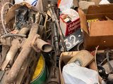 a pile of junk sitting on the ground next to a box