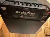 a guitar amplifier sitting on top of a wooden table