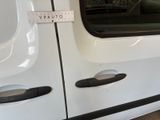 a white van with a measuring tape on the side of it