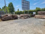 a lot of wood on the ground next to a basketball court