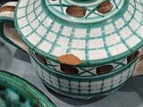 many bowls and bowls that are sitting on a table