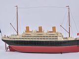 a model of a large boat on a white surface