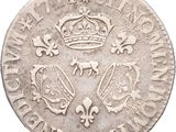 a close up of a coin with a crown on top of it