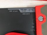a red tool that is sitting on a table