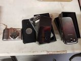 several cell phones are sitting on top of a table next to a camera