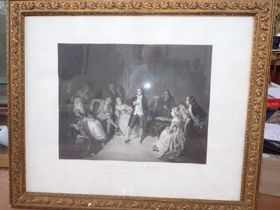 une vieille photo d'un groupe de personnes assises autour d'une table