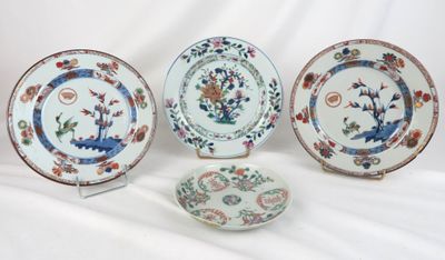 three plates with different designs on them sitting on a white surface