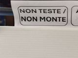a sign on a refrigerator that says non teste non monte