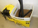 a box with a vacuum and a hose inside of it