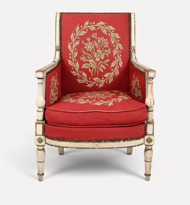 une image représentant une chaise rouge et dorée sur fond blanc