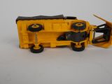 a toy truck that is sitting on a white surface