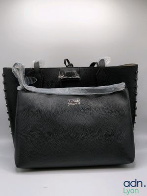 black leather tote bag with silver hardware and zipper closure