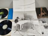 a picture of a table with a bunch of records on it