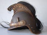 an image of a helmet with a long black hair on a white surface