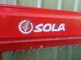 a close up of a red machine with the word sol on it