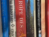 many books that are on a shelf together