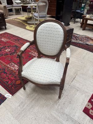a chair that is sitting in the middle of a room